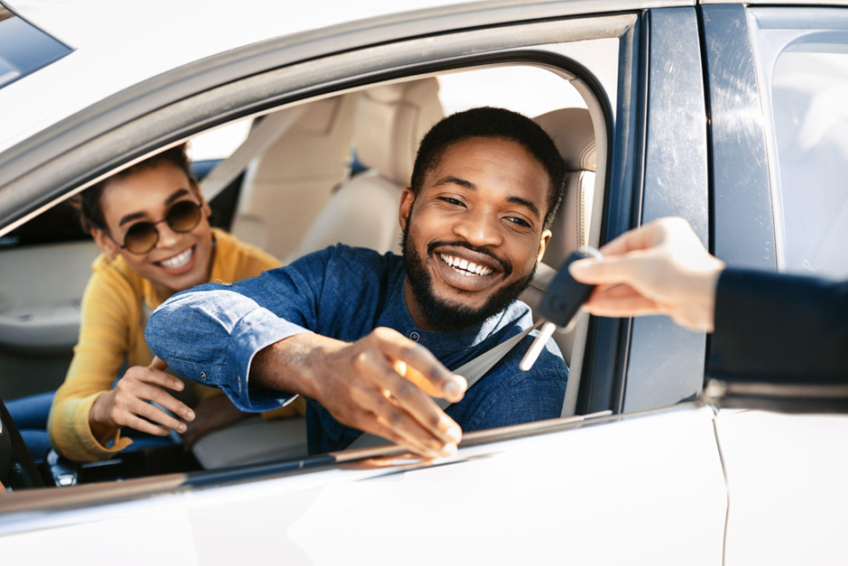 someone in car receiving keys